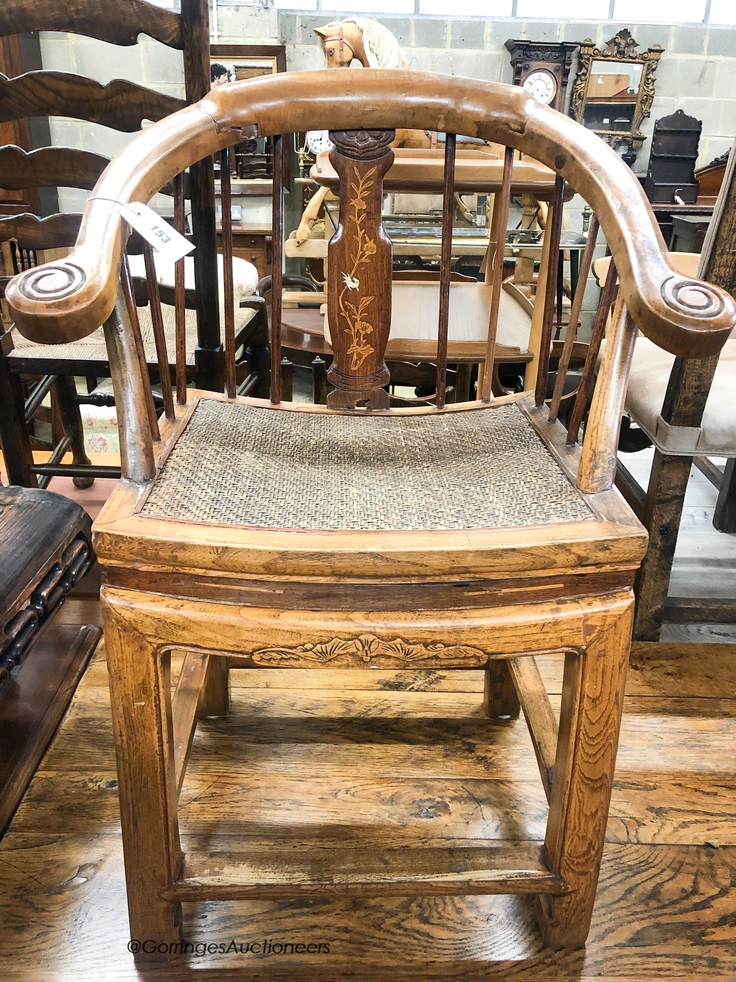 A Chinese elm stickback elbow chair, width 62cm, depth 42cm, height 86cm